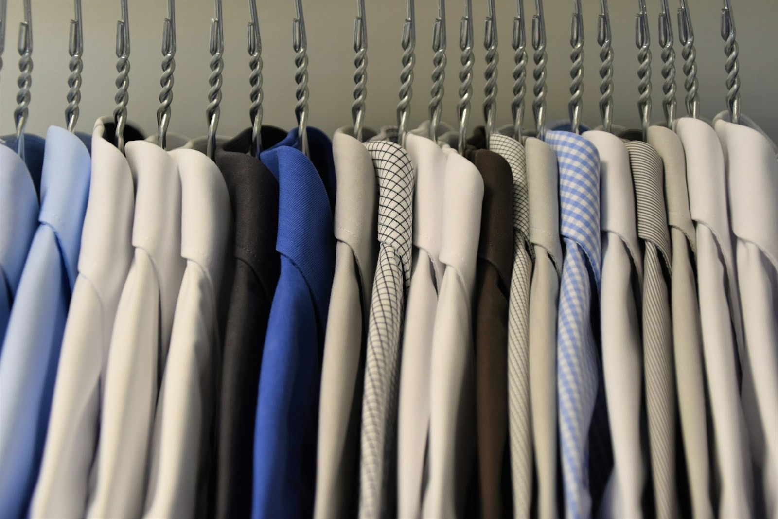 Row of cotton shirts hanging on a clothes rail