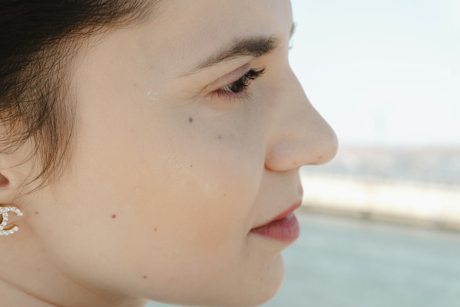 A woman photographed in profile in soft light