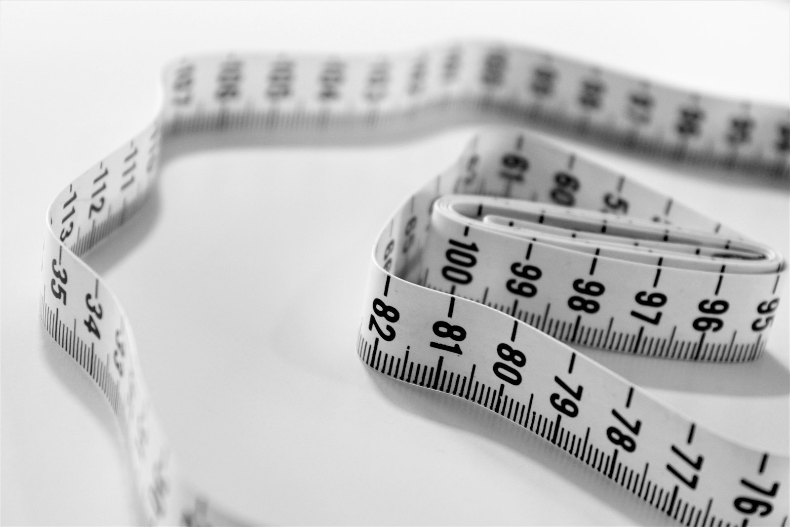 A tape measure on a plain surface